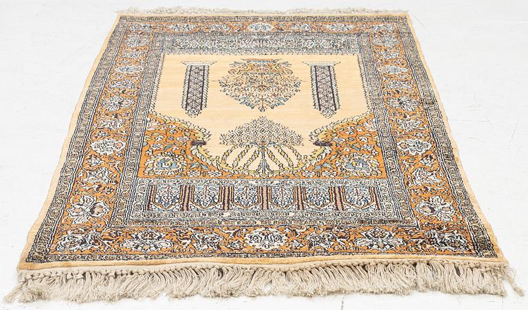 A silk Quum rug, c. 125 x 75 cm.