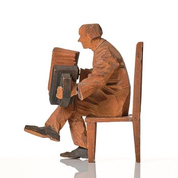 Axel Petersson Döderhultarn, Seated accordionist.