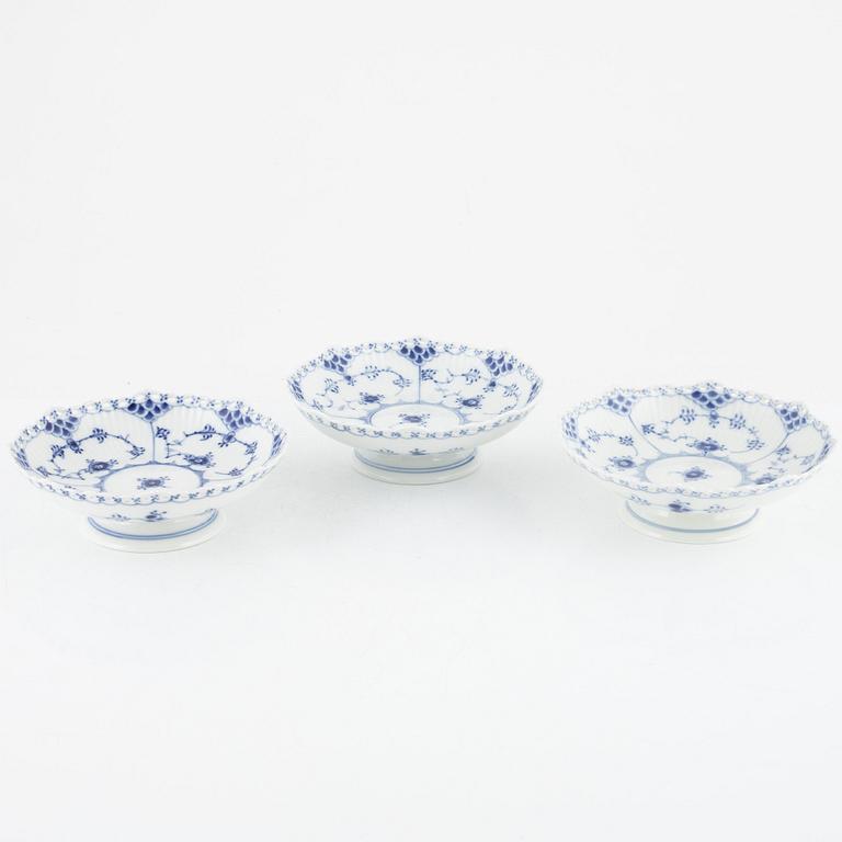 A set of three 'Musselmalet' porcelain bowls on stand from Royal Copenhagen, Denmark.