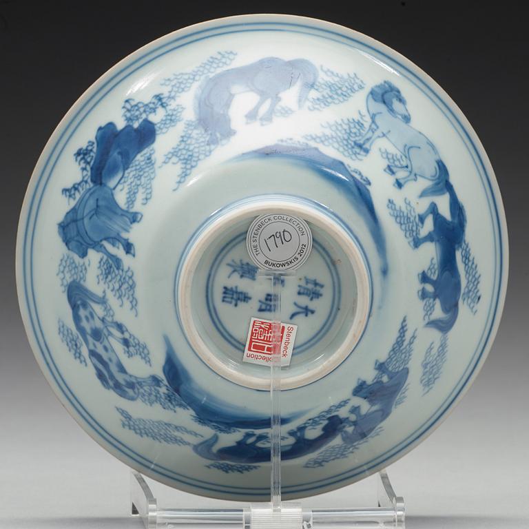 A blue and white bowl with 'General Mu's eight horses', Transition, 17th Century, with Jiajing six character mark.