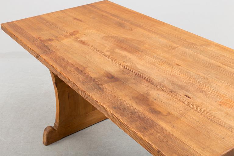 A solid pine table attributed to Axel Einar Hjort.