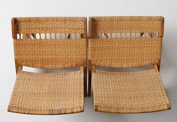 Hans J. Wegner, a pair oak and rattan "model 512" folding chairs by Johannes Hansen, Denmark 1950-60's.