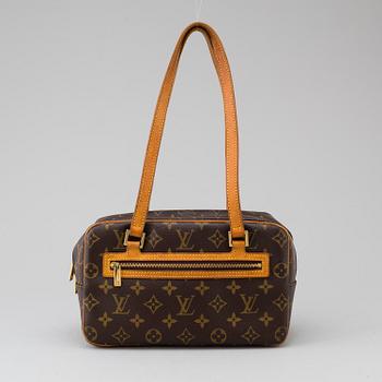 a LOUIS VUITTON ' Cite' bag.