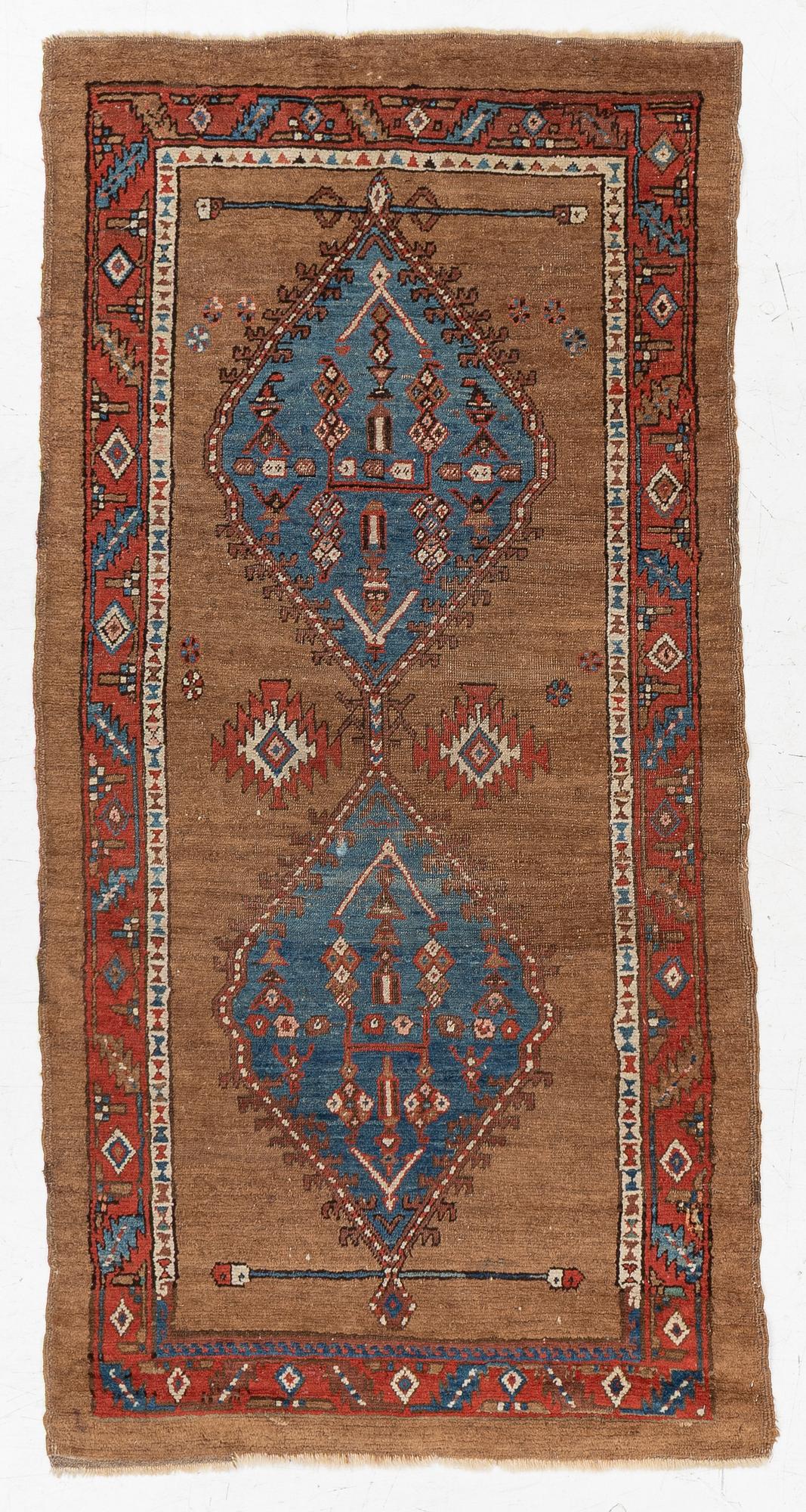 An antique Sarab rug, northwestern Iran, c. 213 x 107 cm.