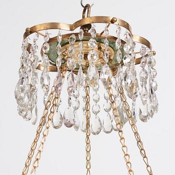 A late Gustavian gilt-brass and green glass six-light chandelier, late 18th century.