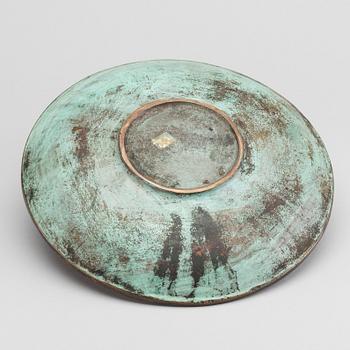 A GUNNAR NYLUND BRONZE PLATE.