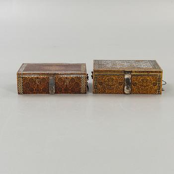 Two perisan metal safety boxes, early 20th Century, one of them with a Russian inkription and dating to 1928.