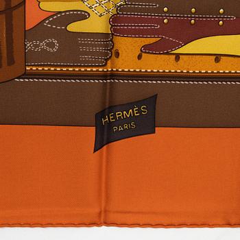 Hermès, a 'Tout cuir' silk scarf.