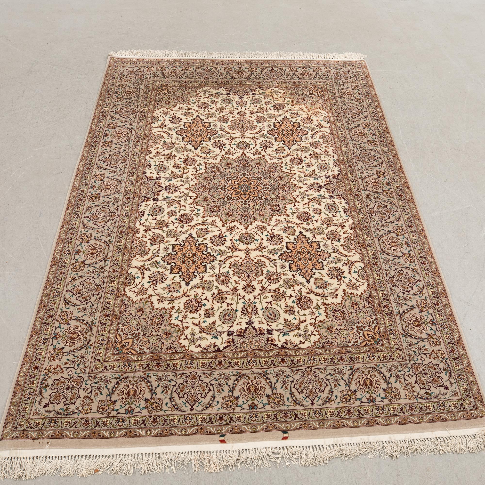 An Isfahan rug, central Persia, signed, 228 x 150 cm.