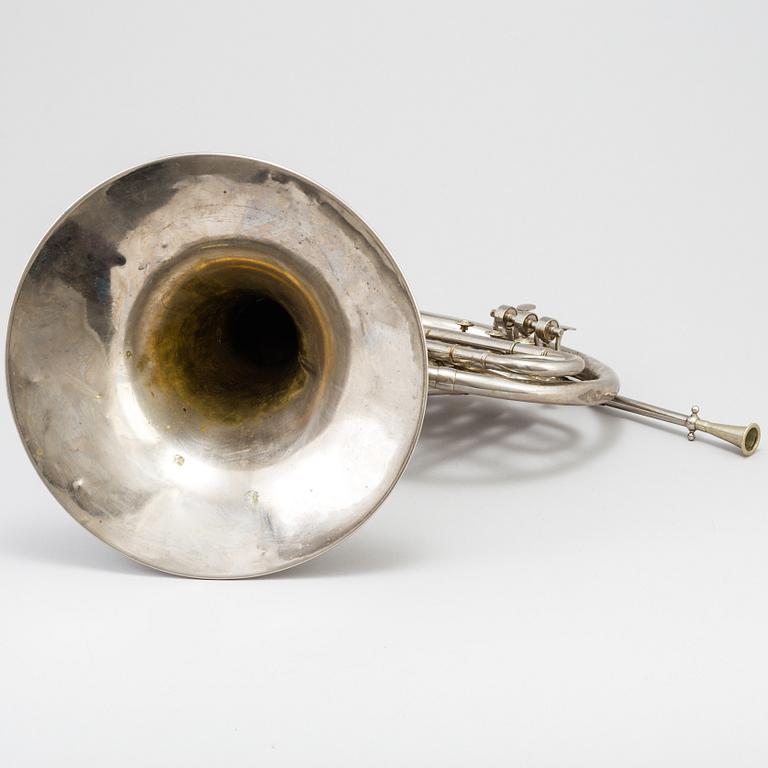 A metal french horn, probably 1936.