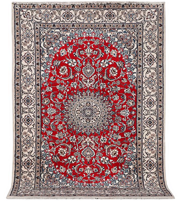 A Nain carpet, part silk, 9 laa, c. 303 x 198 cm.