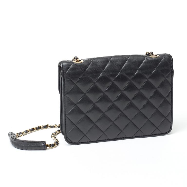 A 1970s black quilt leather shoulder bag by Chanel.