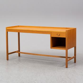 An oak veneered desk, second half of the 20th Century.