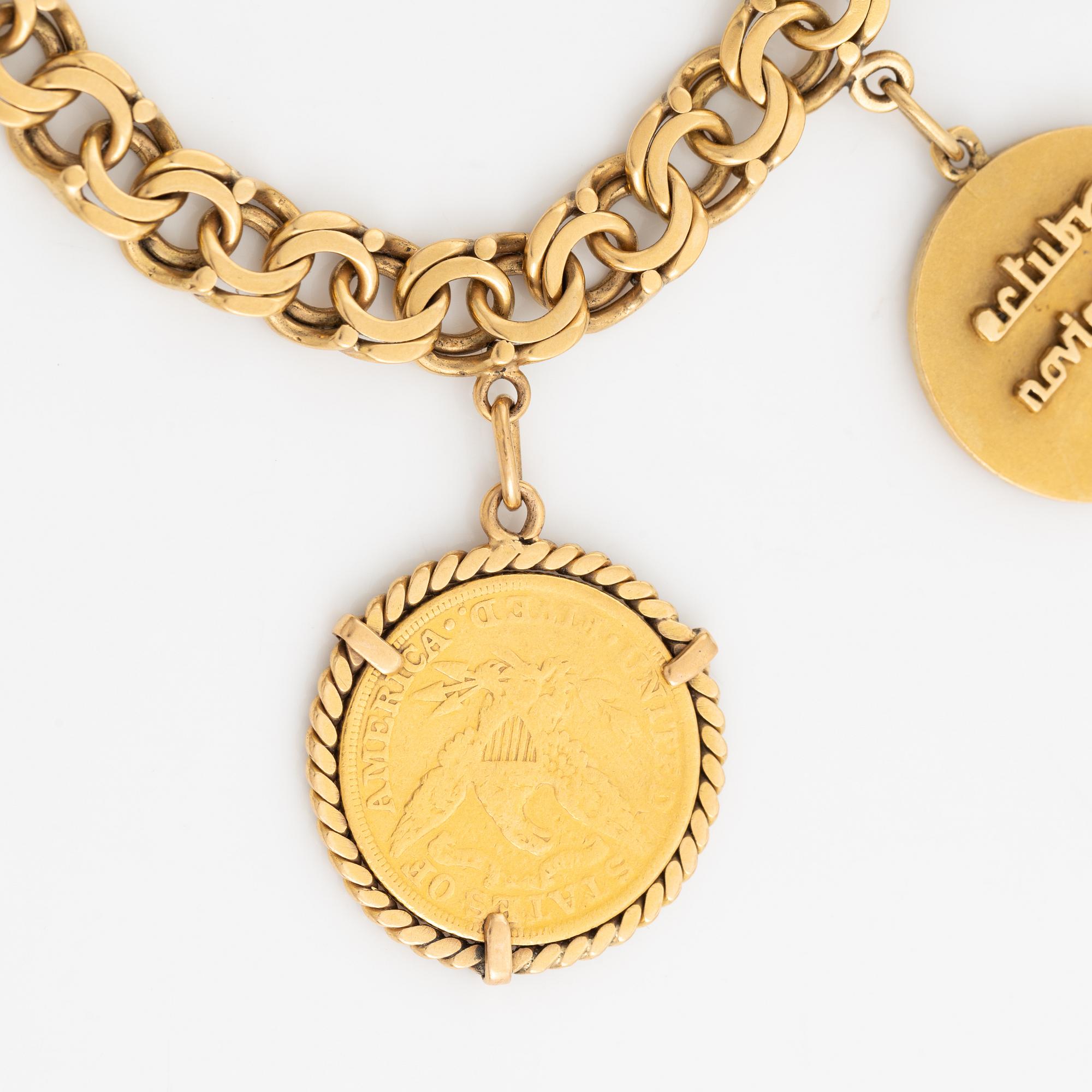 Armband guld bismarcklänk med berlocker med guldmynt.