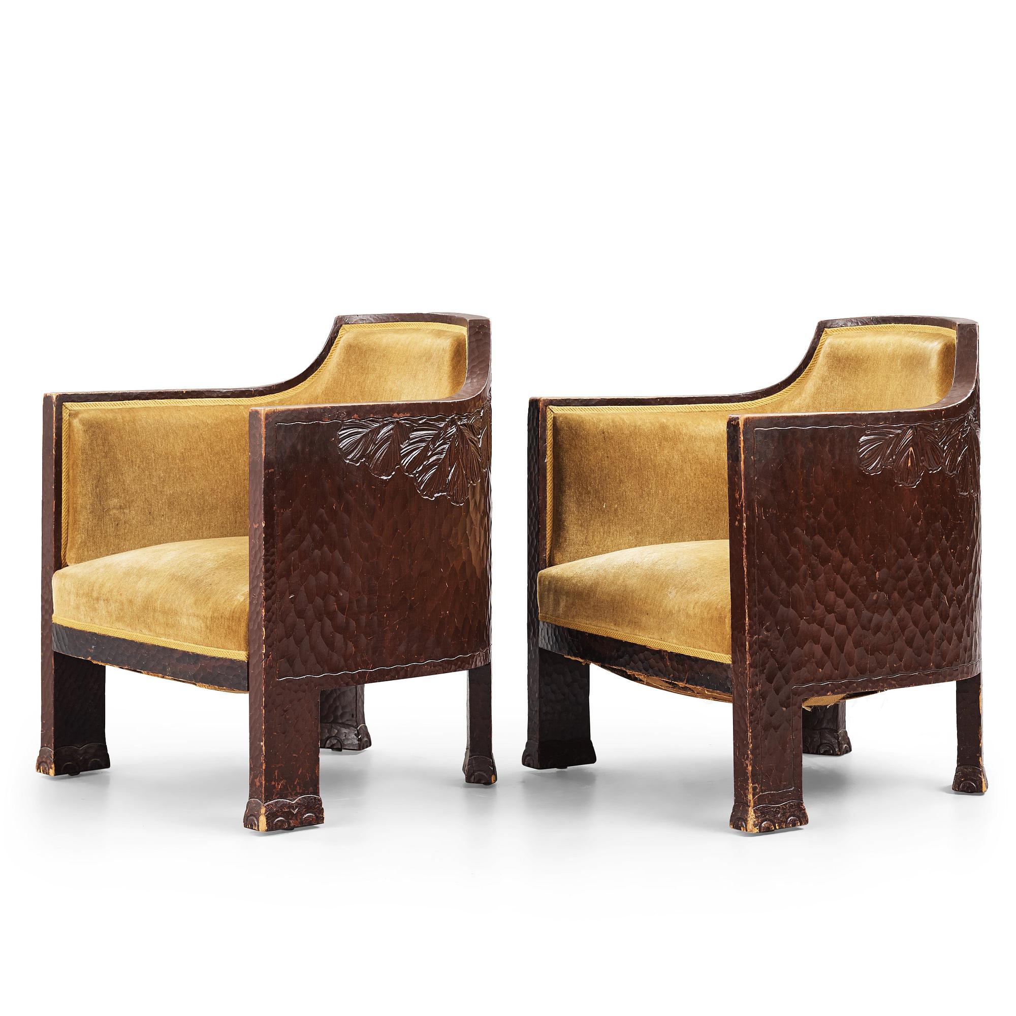 Otto Wretling, attributed to, a pair of Art Nouveau carved pine easy chairs,