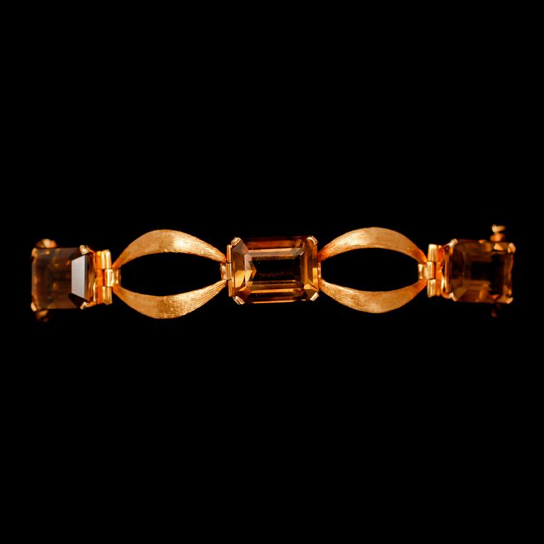 ARMBAND, guld, med röktopaser. Tot vikt 20 g.