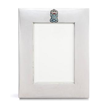 310. A silver and enamel frame with glass, mark of CG Hallberg, Stockholm 1937.