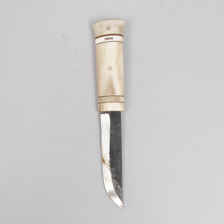 Ingvar Backlund, a reindeer horn knife, signed and dated 99-XX.