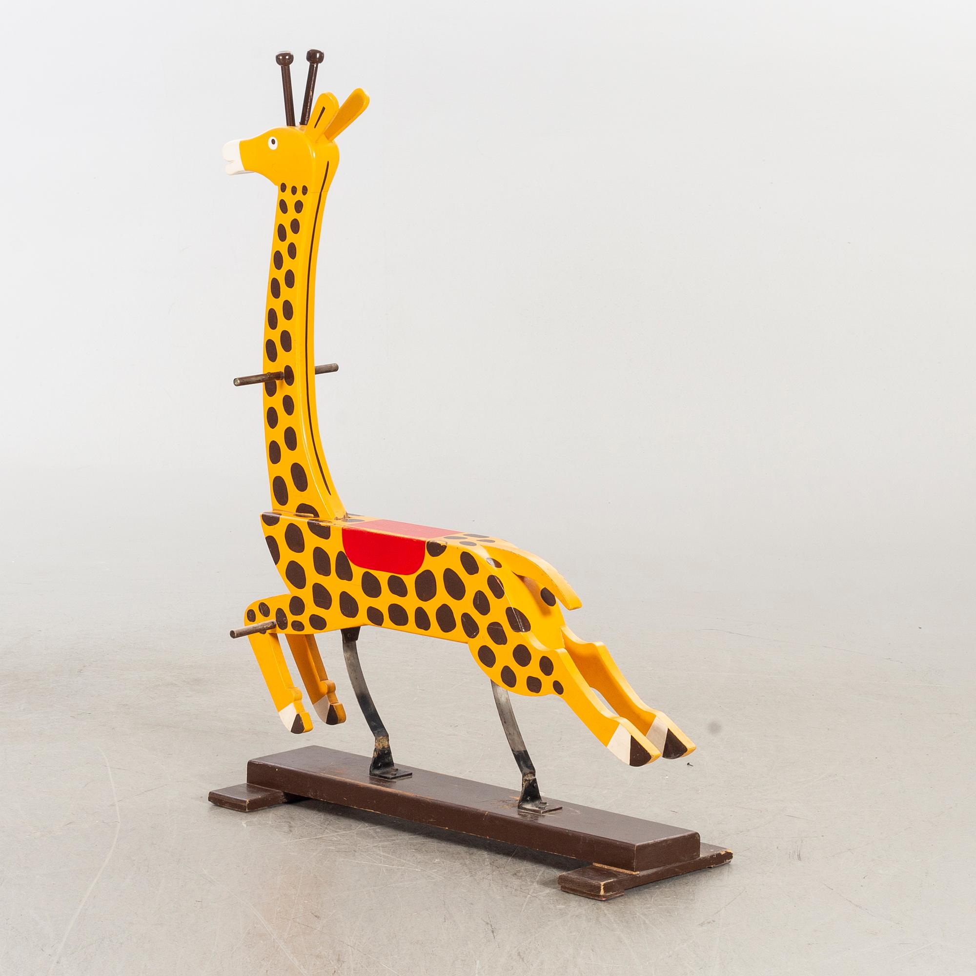 A second half of the 20th century rocking giraffe.
