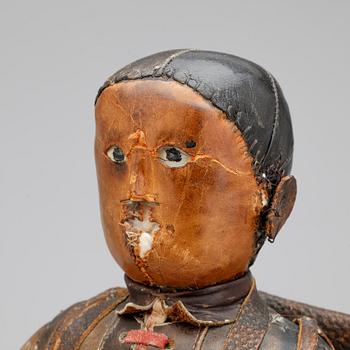 DOCKA, läder, 1800-tal.