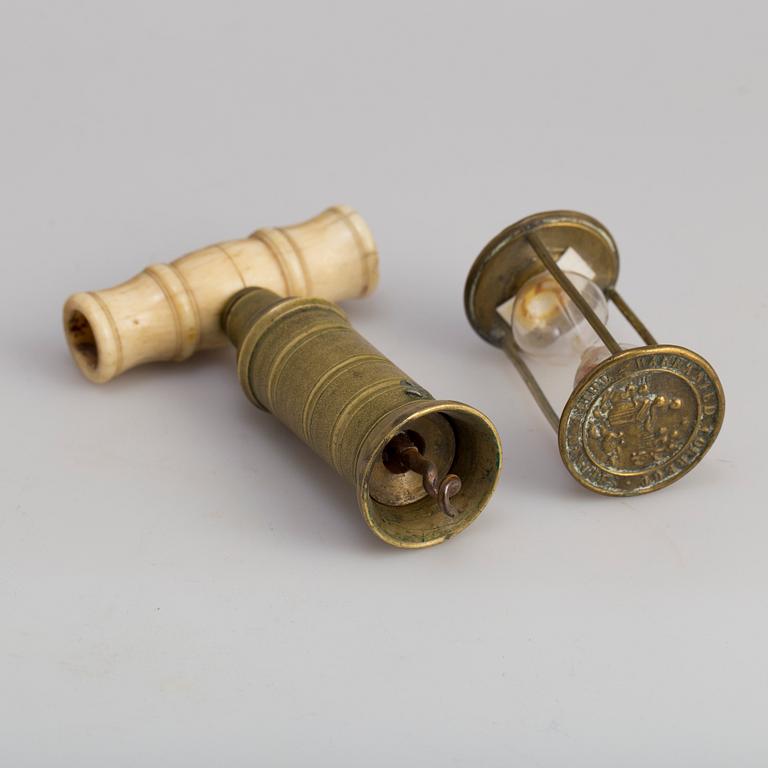 A brass cork screw and hourglass 19th century.