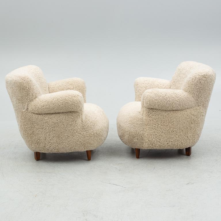 A pair of Swedish Modern easy chairs, mid 20th century.