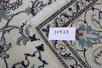 A rug, Nain, part silk, 238 x 163 cm.