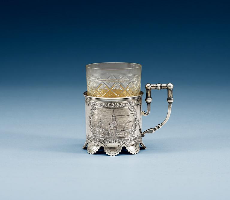 A RUSSIAN PARCEL-GILT TEA-GLASS HOLDER, un identified makers mark, Moscow 1884.