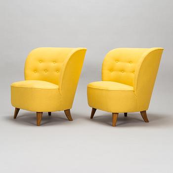 A pair of mid-20th-century armchairs.