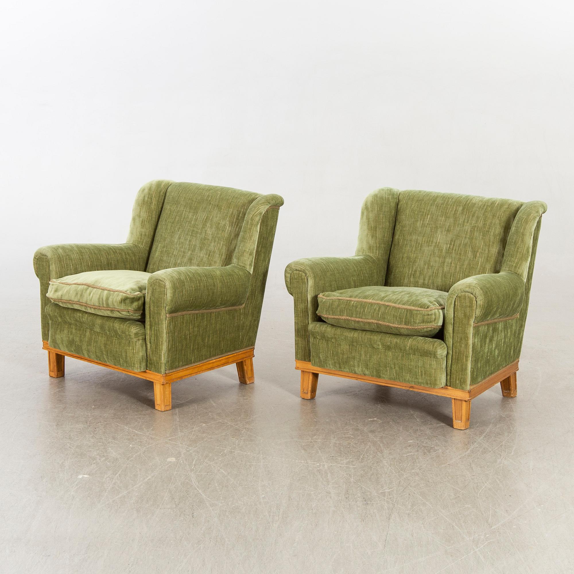 A pair of Swedish Modern lounge chairs.