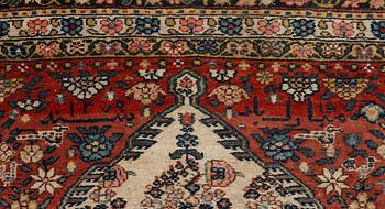 A Bakhtiari carpet, signed, c. 580 x 212 cm.