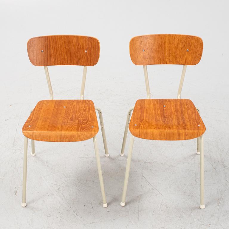 Eight teak veneered chairs, second part of the 20th Century.