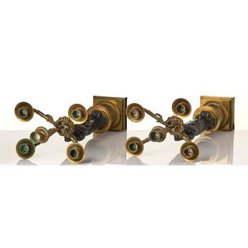 A pair of Fernch Empire ormolu and patinated bronze five-light candelabra, early 19th century.