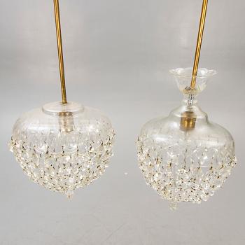 A pair of ceiling pendants around 1900.