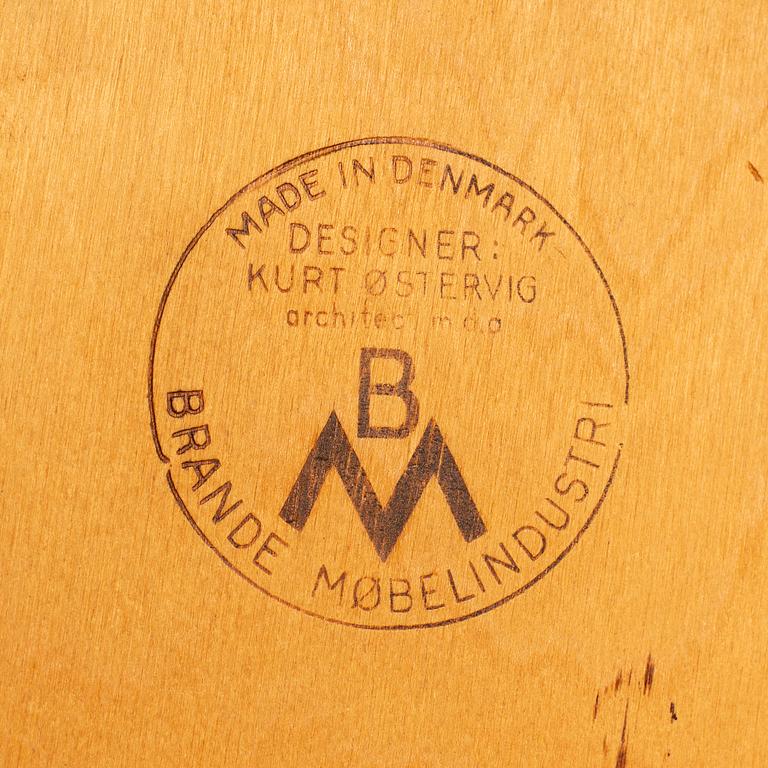 KURT ØSTERVIG, a teak dining suite with a round table and six chairs, Brande Möbelindustri, Denmark.