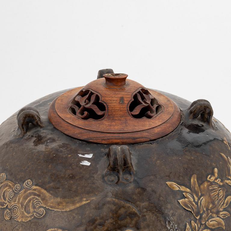 A large brown glazed marthaban jar, presumably late Ming dynasty (1368-1644).