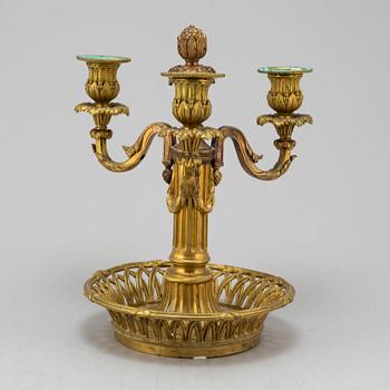 A Louis XVI-style bronze candelabrum, 20th century.