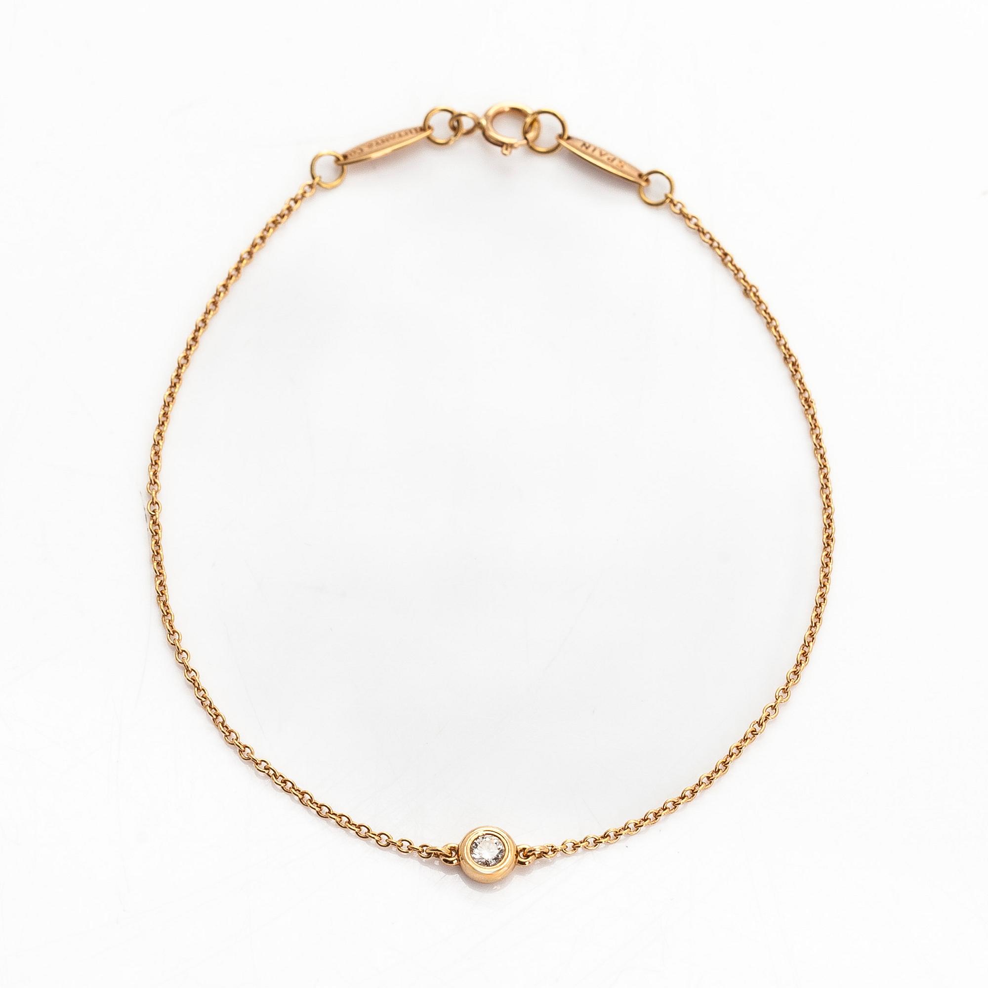 Tiffany & Co, Elsa Peretti, an 18K gold bracelet, 'Diamonds by the Yard', with a diamond approximately 0.08 ct.