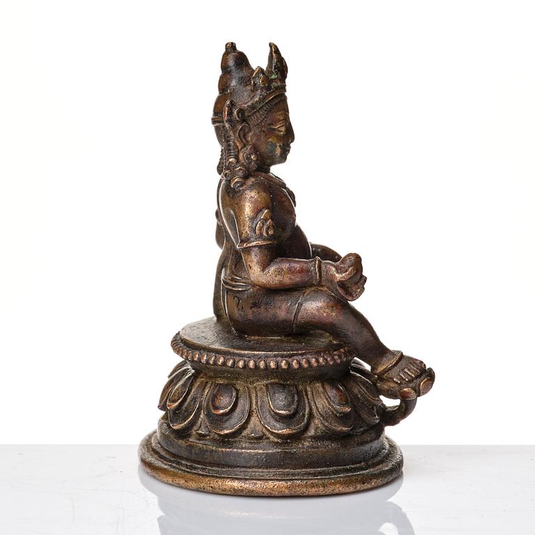 A copper alloy figure of Jambhala, Nepal, possibly 12/13th Century.