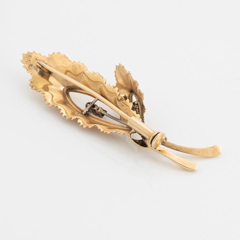 14K gold and sapphire leaf brooch.