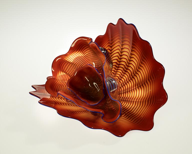 A Dale Chihuly three piece seaform set of red and blue glass, Seattle, USA.