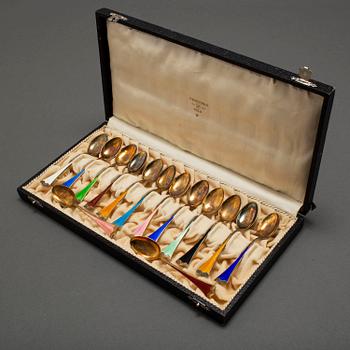 J TOSTRUP, 14 silver gilt and enamel coffee stoons from Oslo, Norway.