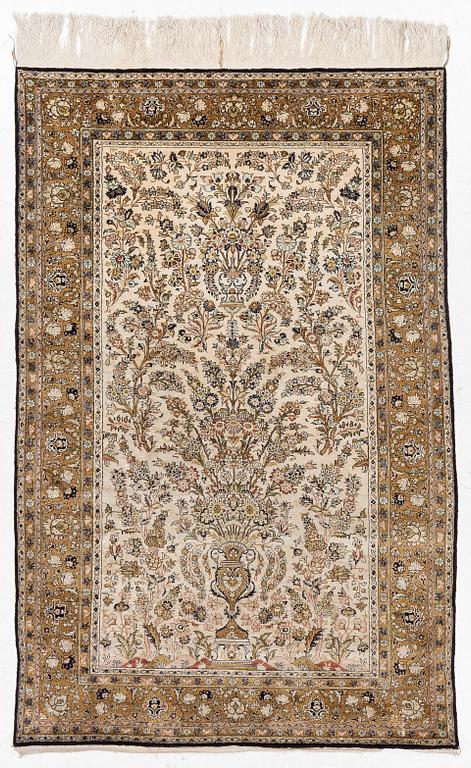 A Ghom, silk rug, c. 215 x 140 cm.