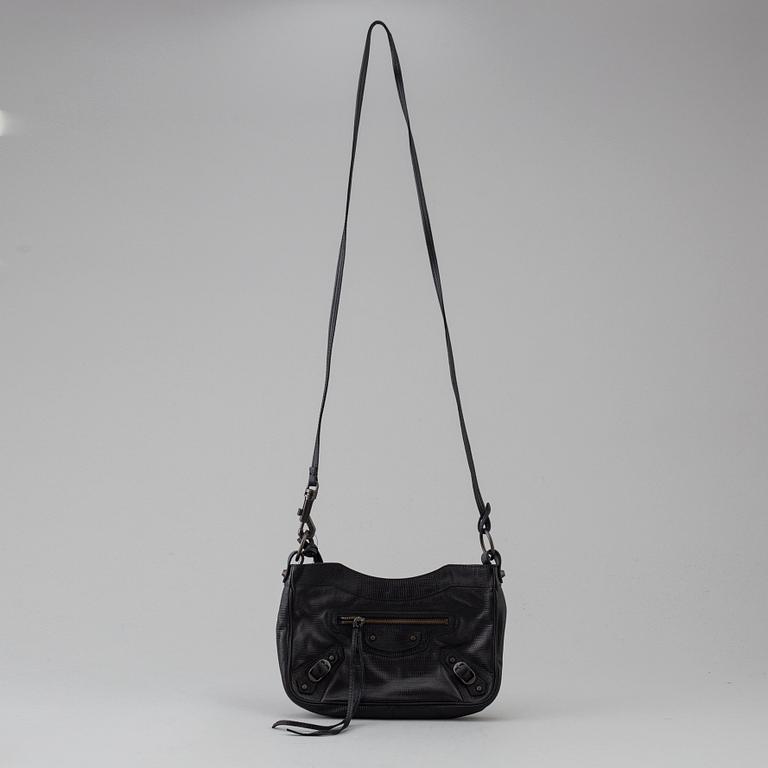 A black alligator printed leather "Classic hip" bag by Balenciaga.