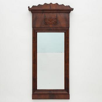A Swedish Empire mirror with a console table, first half of the 19th Century.