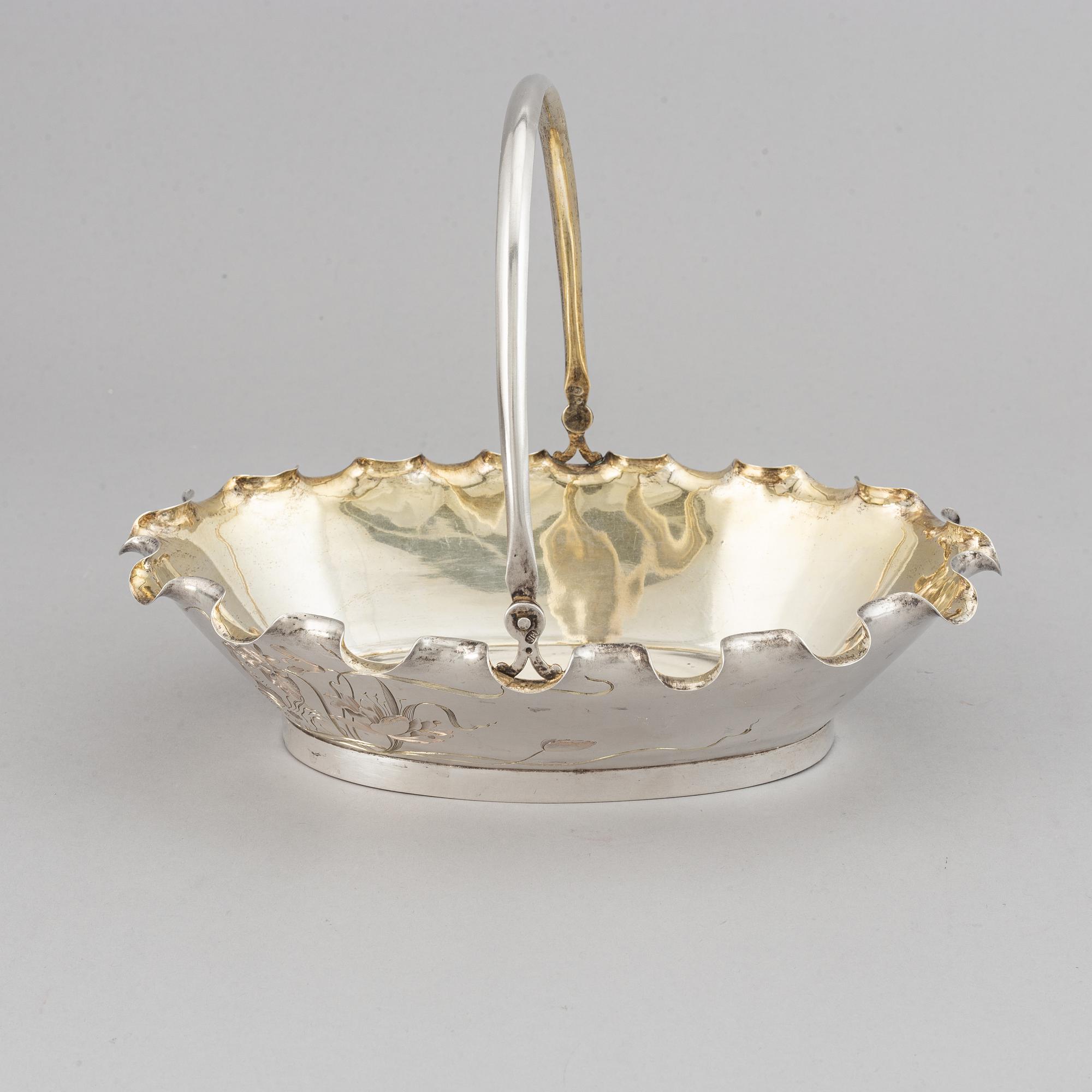 A Russian early 20th century parcel-gilt silver basket, unidentified makers mark, Moscow 1899-1908.