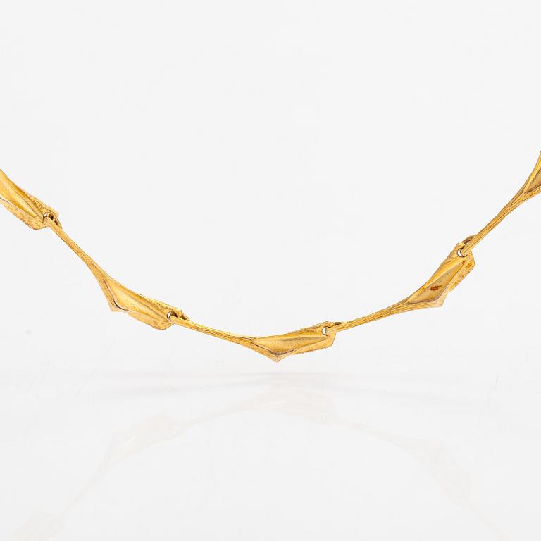 Björn Weckström, Halsband "Konvojens skugga", 14K guld. Lapponia 1974.