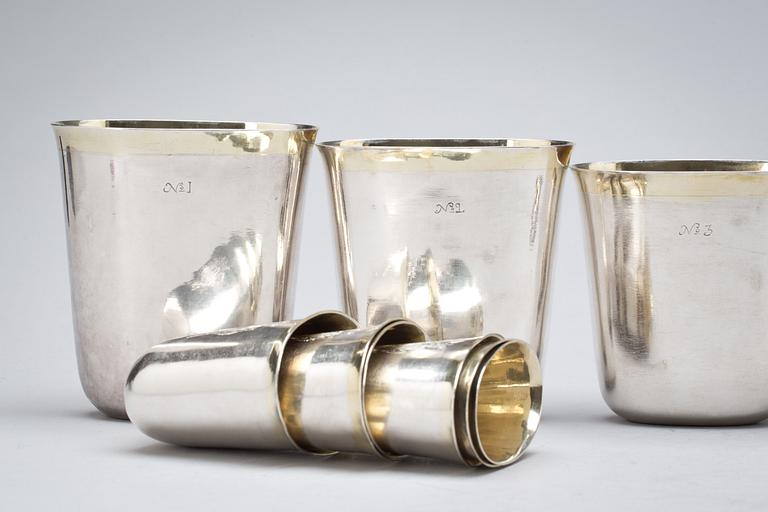 A set of 12 Swedish early 18th century parcel-gilt hunting-beakers and cover, marks of Petter Henning, Stockholm 1707.