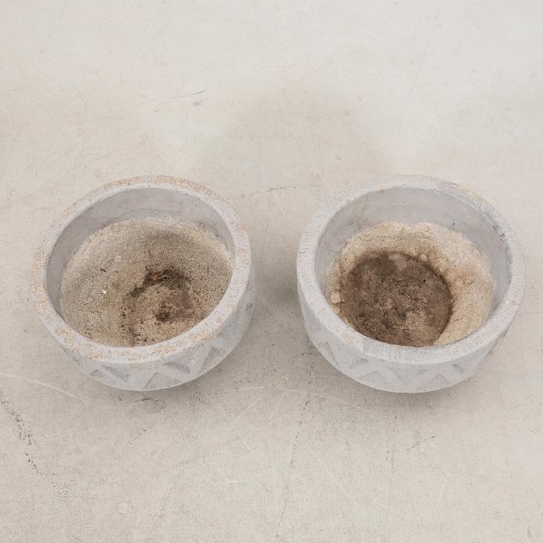 A pair of concrete garden urns later part of the 20th century.