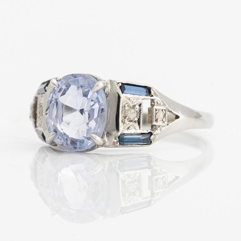 Ring with light blue sapphire.